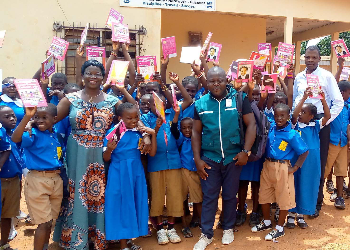 Happy children receive text books